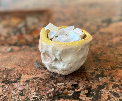 pinchpot ceramic bowl, white and yellow